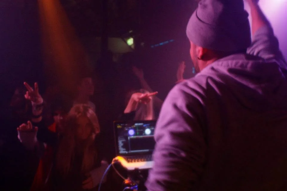 A DJ cueing a record at the Man Hotel, Falls Creek