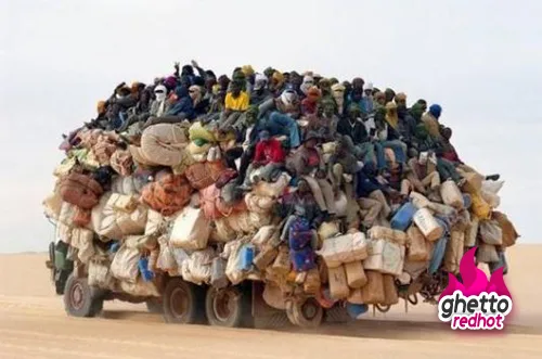 An overloaded removal truck piled high with cargo, used to mark the move to a new site