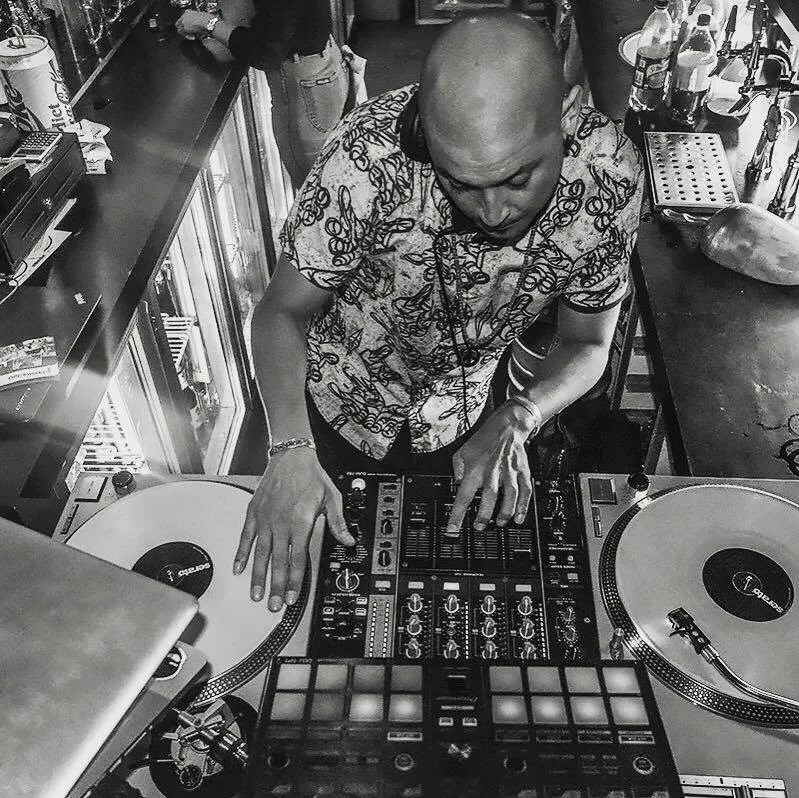 An overhead black and white shot of the turntables mid-set